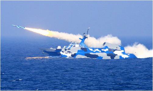 A Chinese warship launches a missile in the East China Sea on 6 July 2010. 