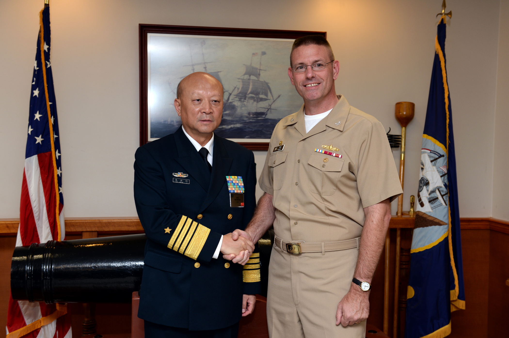 140918-N-PX557-067 NEWPORT, R.I. (Sept. 18, 2014) Commander in Chief of the People's Liberation army navy of the People's Republic of China Adm. Wu Shengli poses for a photo with Capt. Dave Welch, commanding officer, Surface Warfare Officers School (SWOS), at the SWOS quarterdeck onboard Naval Station Newport in Newport, Rhode Island. Welch provided a tour of the school for Shengli and his staff members who are currently in Newport attending the Chief of Naval Operations’ 21st International Seapower Symposium (ISS) at U.S. Navy War College. More than 170 senior officers and civilians from more than 100 countries, including many of the senior-most officers from those countries’ navies, are currently attending ISS, Sept. 16-19. SWOS provides a continuum of professional education and training in support of surface Navy requirements that prepares officers and enlisted engineers to serve at sea. (U.S. Navy photo by Chief Mass Communication Specialist James E. Foehl/Released)