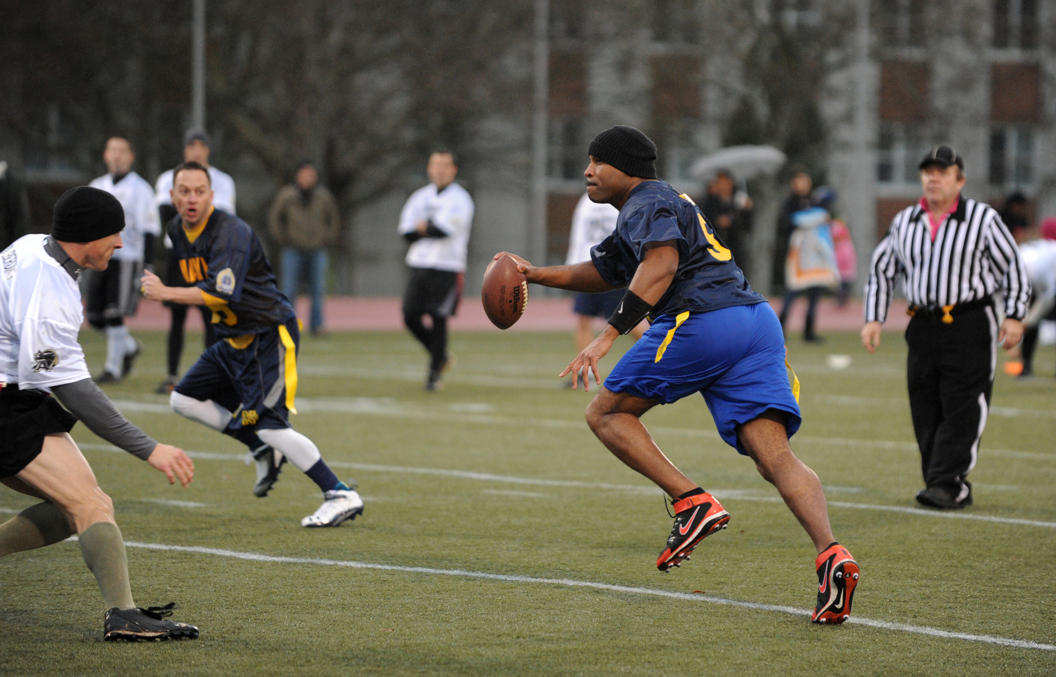131206-N-PX557-075 NEWPORT, R.I. (Dec. 6, 2013) Lt. Cmdr. Alex Hampton, a student attending U.S. Naval War College (NWC), scrambles to make a pass during an Army-Navy flag football game at Nimitz Field onboard Naval Station Newport in Newport, R.I. The game was held as a precursor to the college football rivalry game between U.S. Naval Academy, Navy Midshipmen, and U.S. Military Academy, Army Black Knights, scheduled for Dec. 14, at Lincoln Financial Field in Philadelphia, Pa. The NWC Navy flag football team triumphed over the NWC Army team with a final score of 24-0. (U.S. Navy photo by Chief Mass Communication Specialist James E. Foehl/Released)