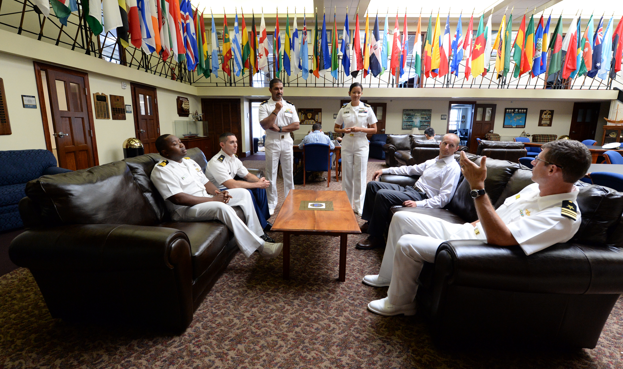 150826-N-PX557-134 NEWPORT, R.I. (Aug. 26, 2015) Nigerian navy Lt. Cmdr. Andy Zidon, Army Maj. Geoff Shorr, Kuwaiti navy Cmdr. Mohammad Alarefi, Lt. Cmdr. Katharine Cerezo, Air Force Maj. Joe Hanscom and Lt. Cmdr. Ted Huebner engage in conversation while attending U.S. Naval War College in Newport, Rhode Island as Naval Staff College students. Naval Staff College is a resident international program for intermediate-level officers who are integrated with their U.S. counterparts. Officers enrolled in international courses benefit from a robust field studies program that illustrates how the U.S. functions in all respects including; democratic ideals of elected government, internationally recognized human rights, free enterprise, judicial system, industry, diversity of society, press, political parties and interest groups, media and civil-military relations. (U.S. Navy photo by Chief Mass Communication Specialist James E. Foehl/Released)